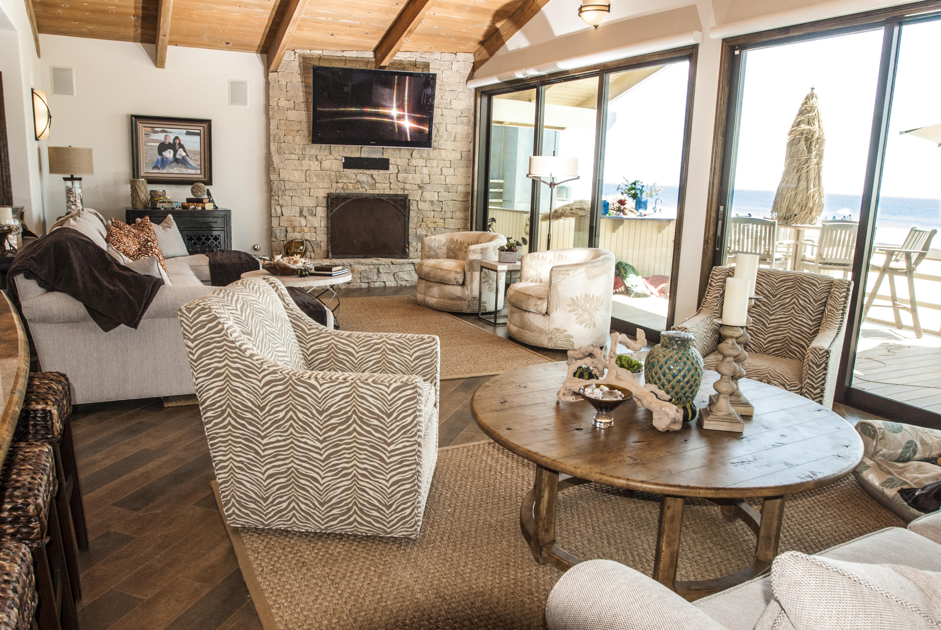 867 Mandalay Beach Road Oxnard, CA 93035 - Photo 23 of 27 a living room with furniture fireplace and a large window