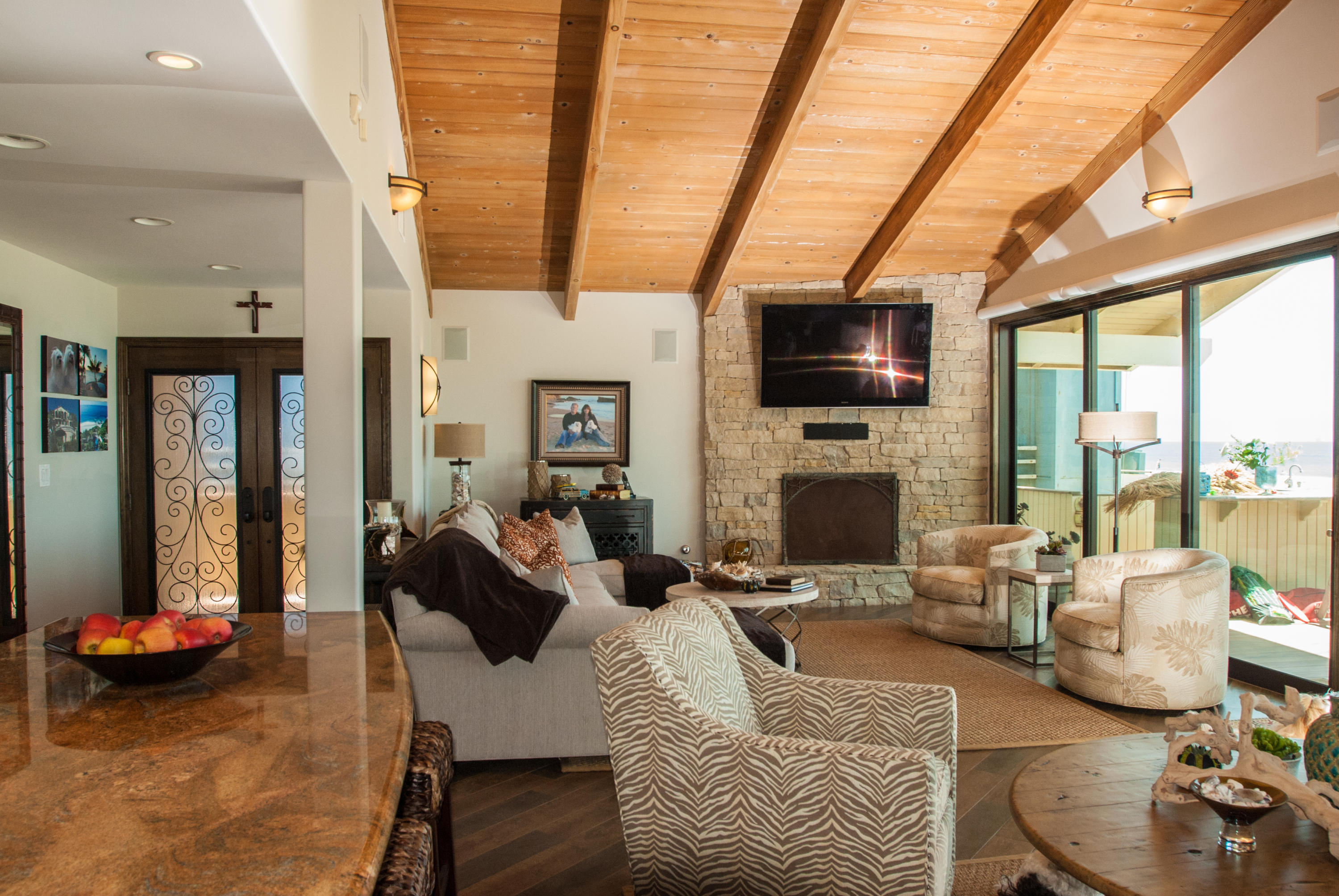 867 Mandalay Beach Road Oxnard, CA 93035 - Photo 24 of 27 a living room with furniture fireplace and a flat screen tv