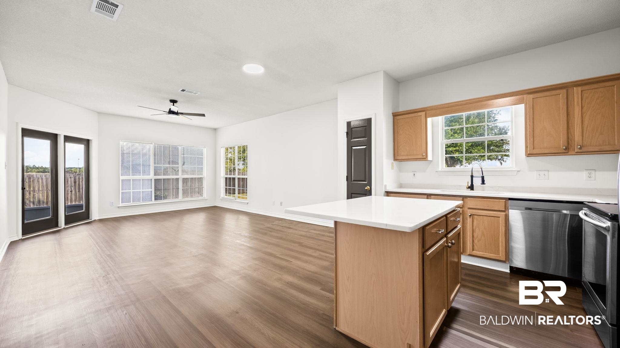 2651 South Juniper Street, Unit 705 Foley, AL 36535 - Photo 8 of 37 Open-concept living space featuring wood-finish flooring, a contemporary ceiling fan, and recessed lighting