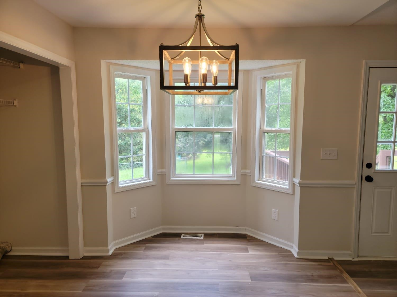 112 Pebblestone Court Willow Spring, NC 27592 - Photo 15 of 43 an empty room with wooden floor and windows