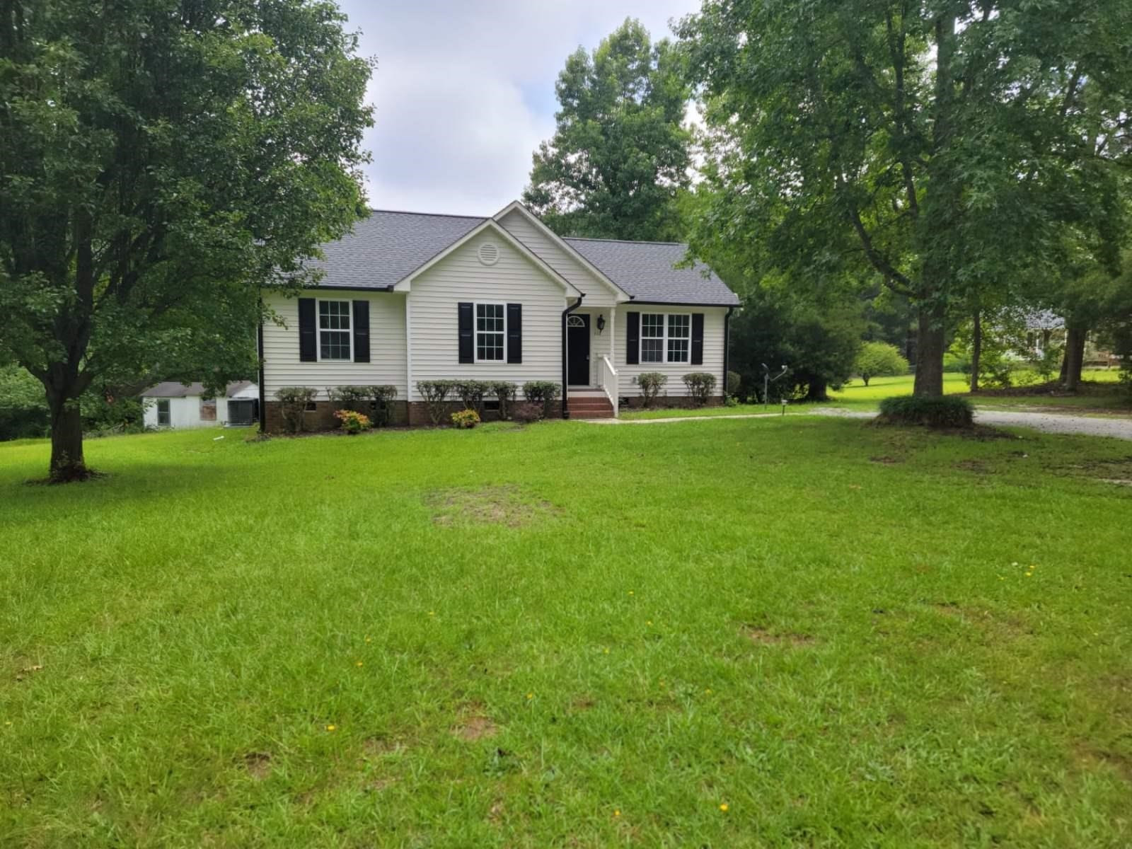 112 Pebblestone Court Willow Spring, NC 27592 - Photo 2 of 43 a front view of a house with garden