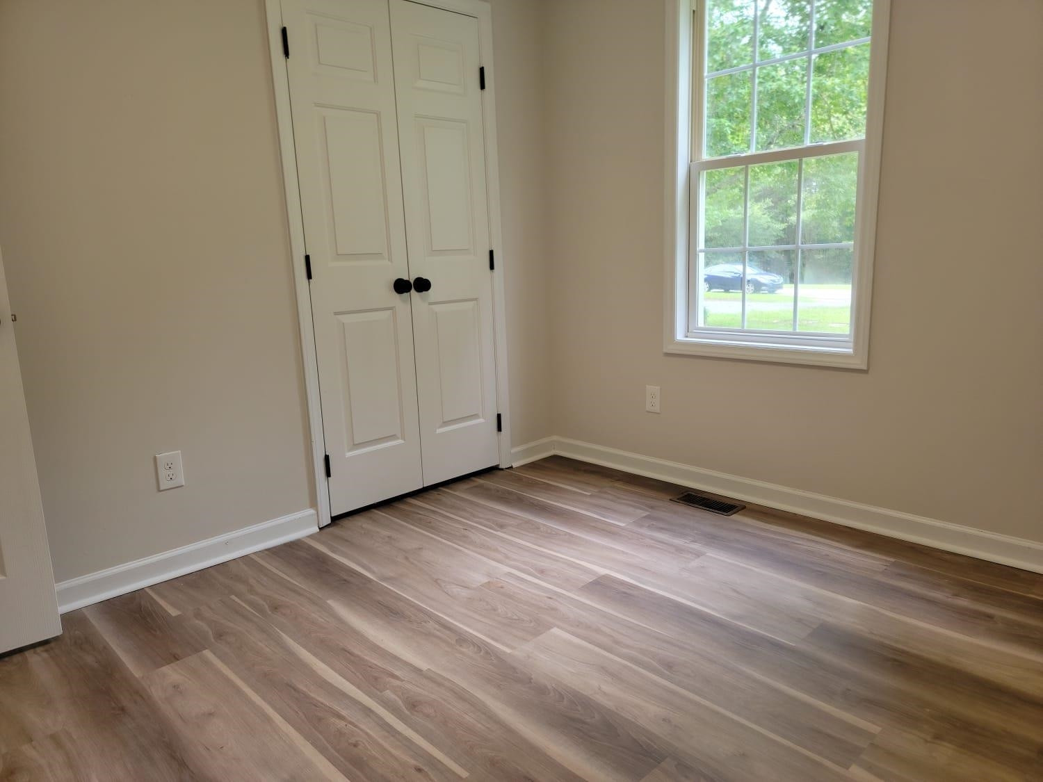 112 Pebblestone Court Willow Spring, NC 27592 - Photo 23 of 43 a view of a room with wooden floor and window