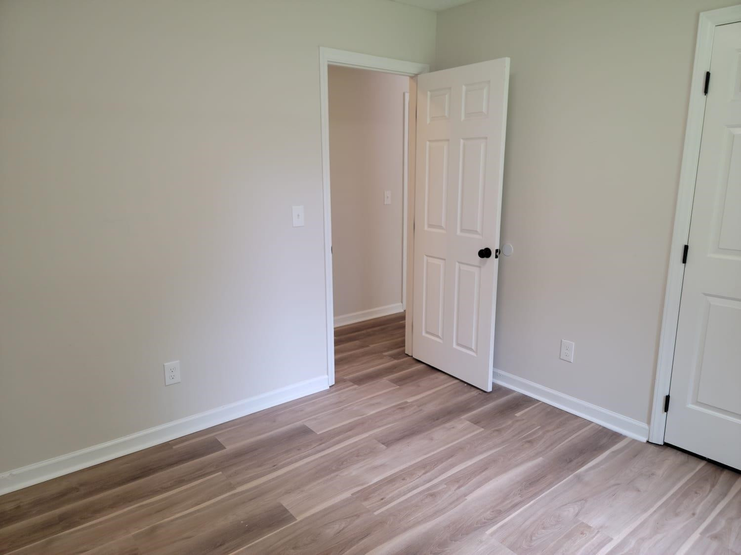 112 Pebblestone Court Willow Spring, NC 27592 - Photo 25 of 43 a view of an empty room with wooden floor