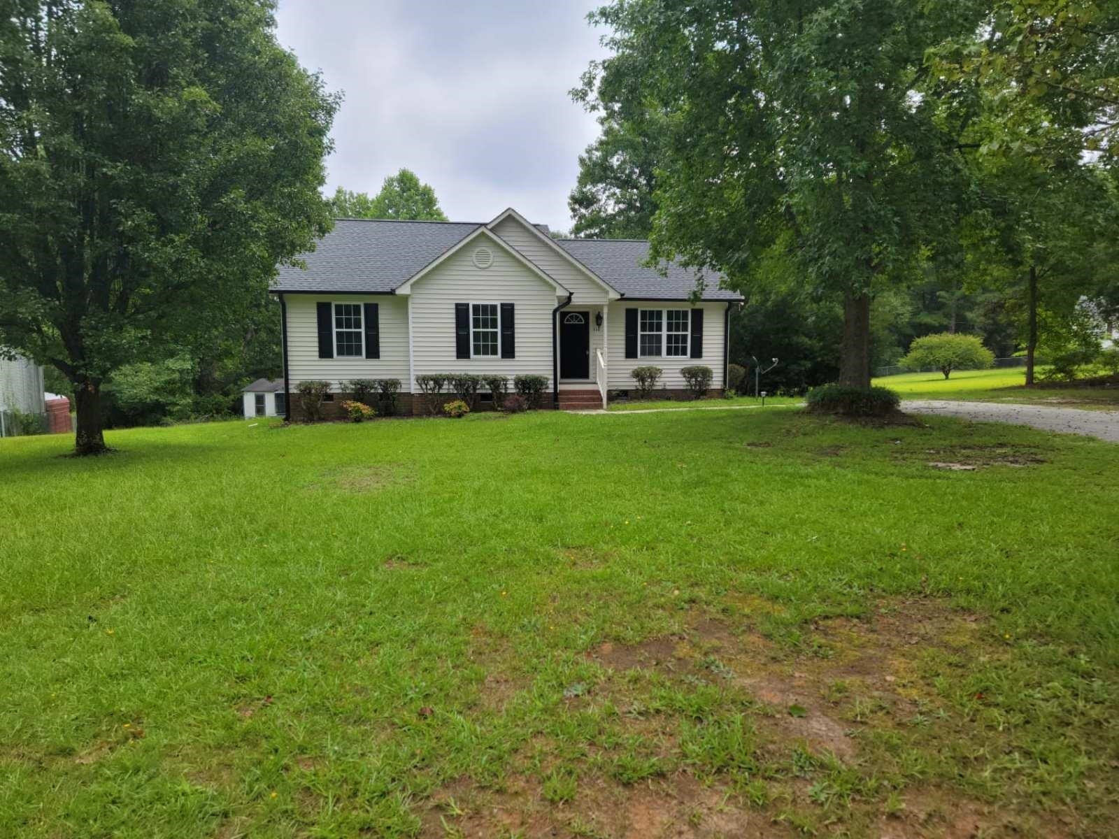 112 Pebblestone Court Willow Spring, NC 27592 - Photo 3 of 43 a front view of a house with yard and trees