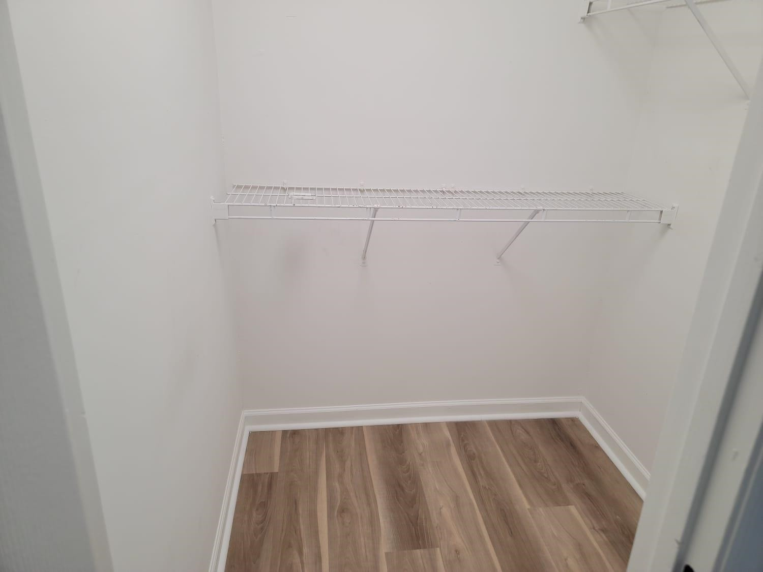 112 Pebblestone Court Willow Spring, NC 27592 - Photo 33 of 43 a view of a room with racks on the wall