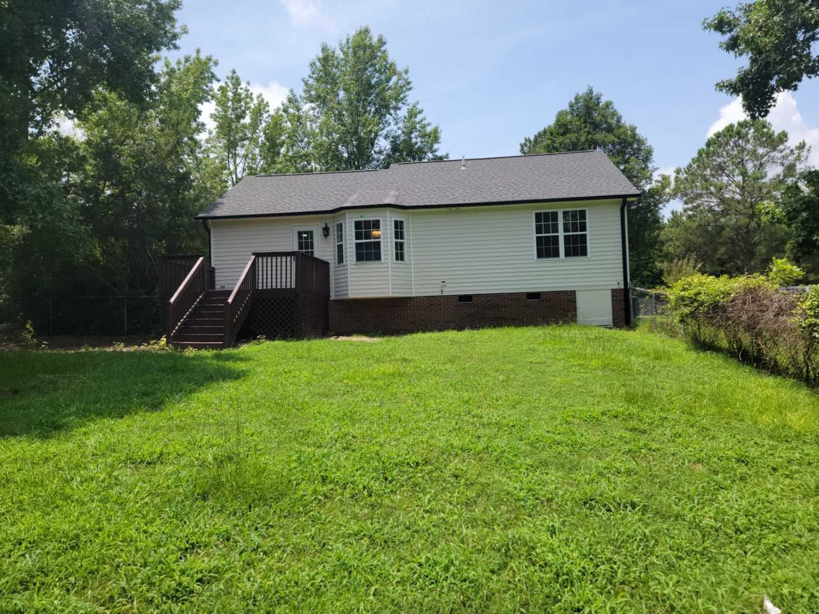 112 Pebblestone Court Willow Spring, NC 27592 - Photo 36 of 43 a front view of a house with yard and green space