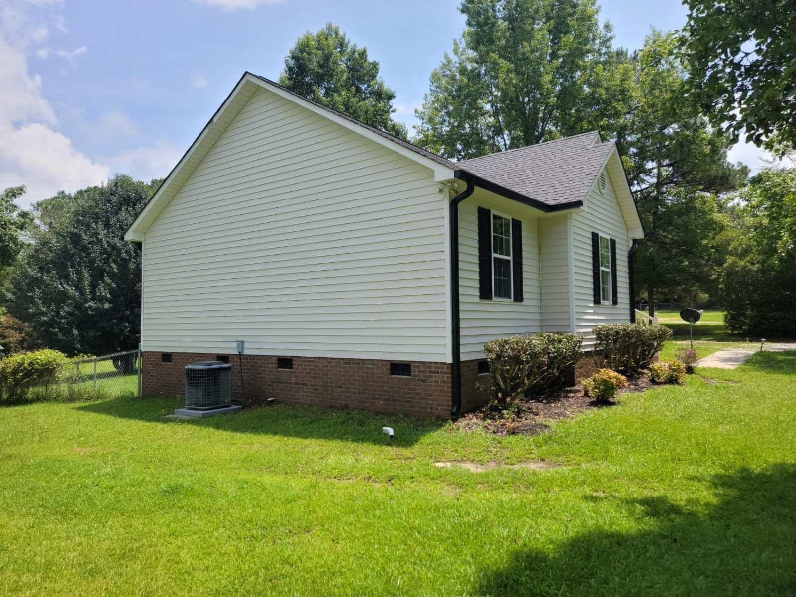 112 Pebblestone Court Willow Spring, NC 27592 - Photo 40 of 43 a view of a house with a backyard