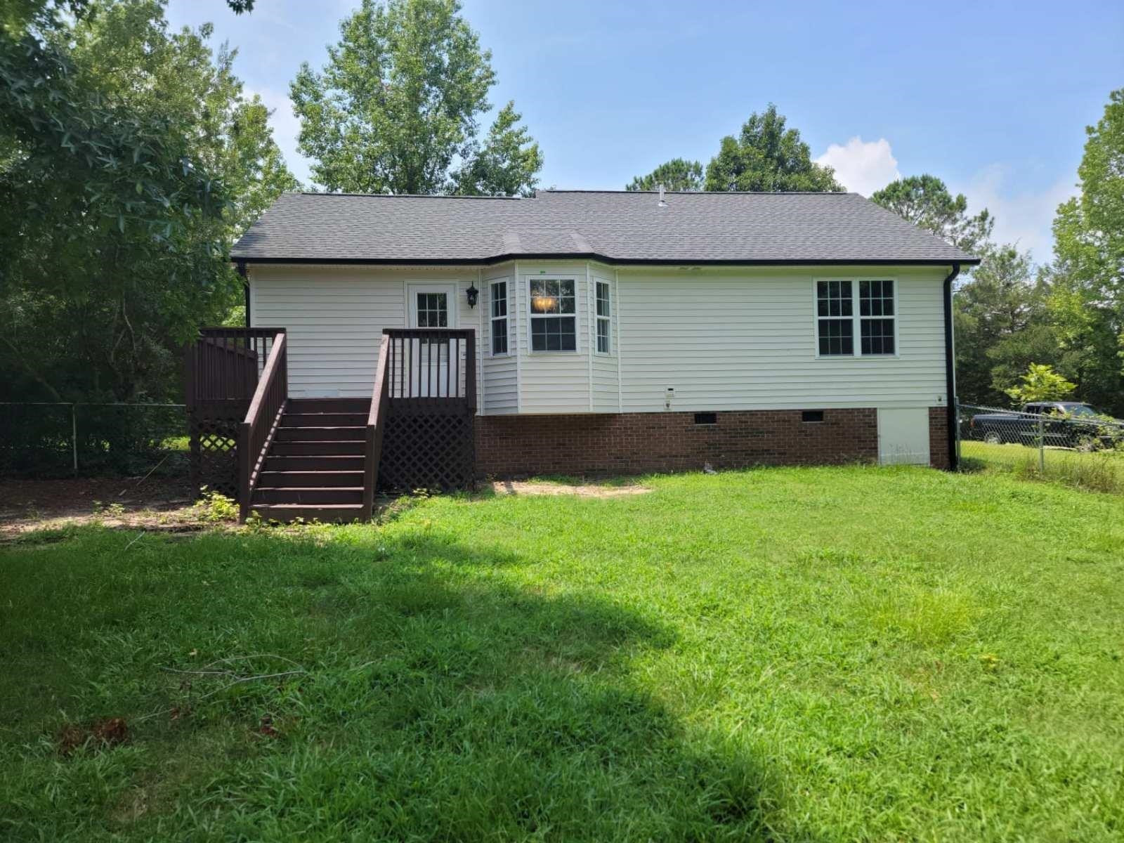 112 Pebblestone Court Willow Spring, NC 27592 - Photo 42 of 43 a front view of a house with a yard