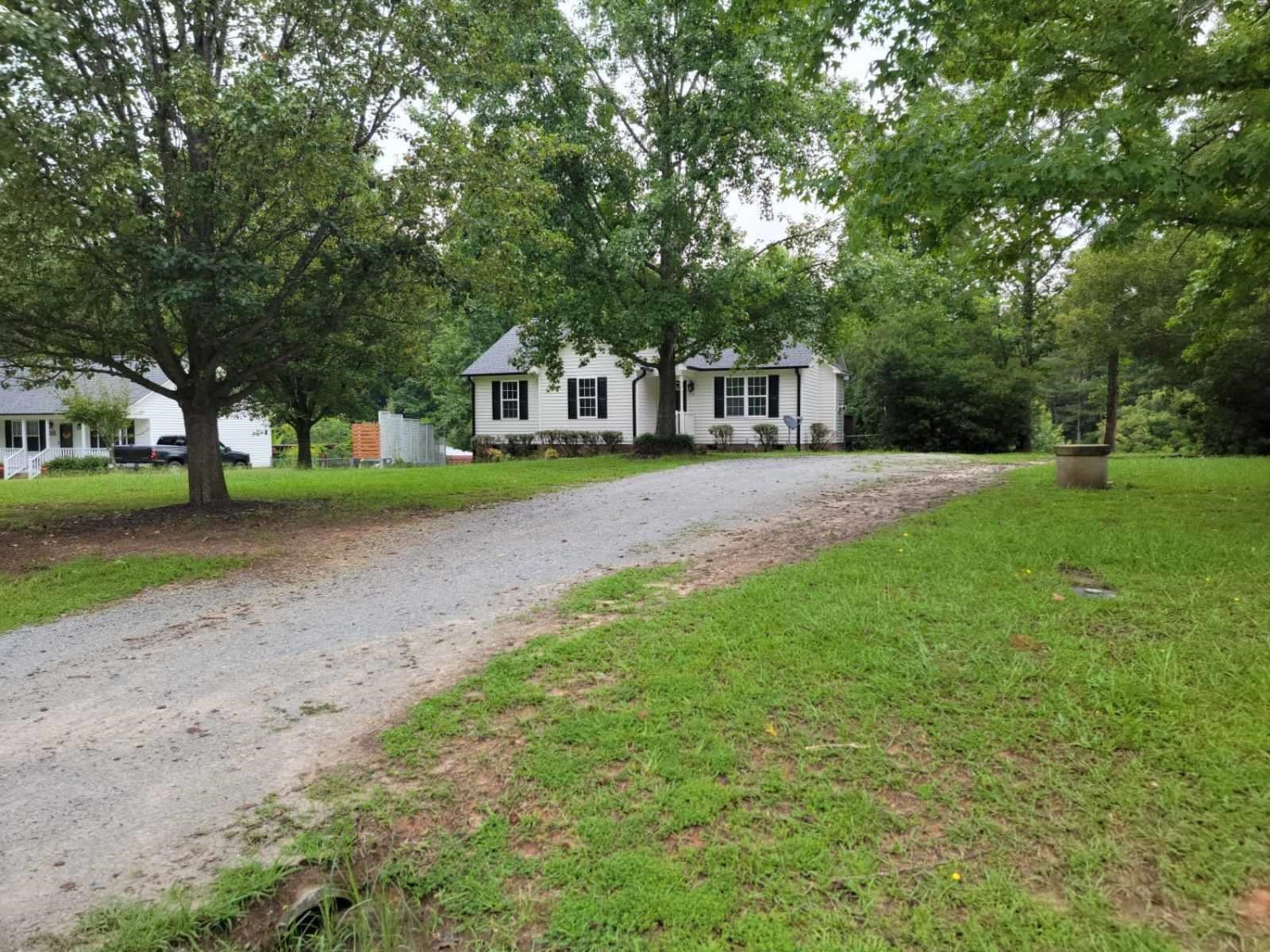 112 Pebblestone Court Willow Spring, NC 27592 - Photo 5 of 43 a front view of a house with a yard and trees