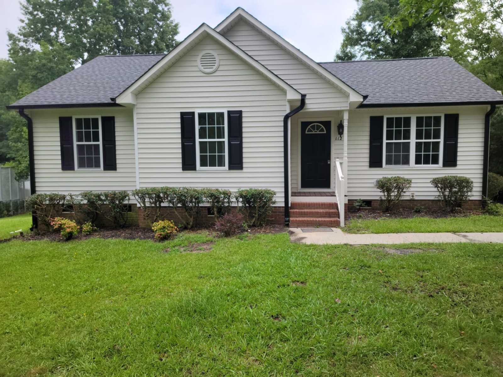 112 Pebblestone Court Willow Spring, NC 27592 - Photo 6 of 43 a front view of a house with a yard