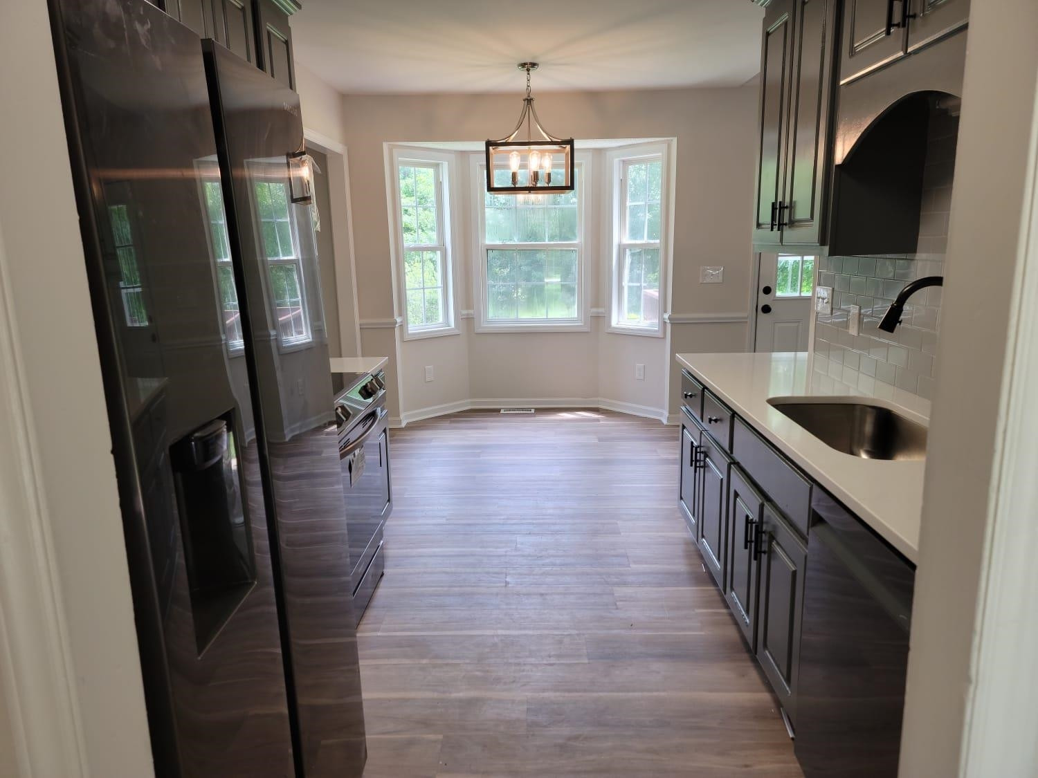 112 Pebblestone Court Willow Spring, NC 27592 - Photo 8 of 43 a kitchen with stainless steel appliances granite countertop a refrigerator a sink a stove and a refrigerator