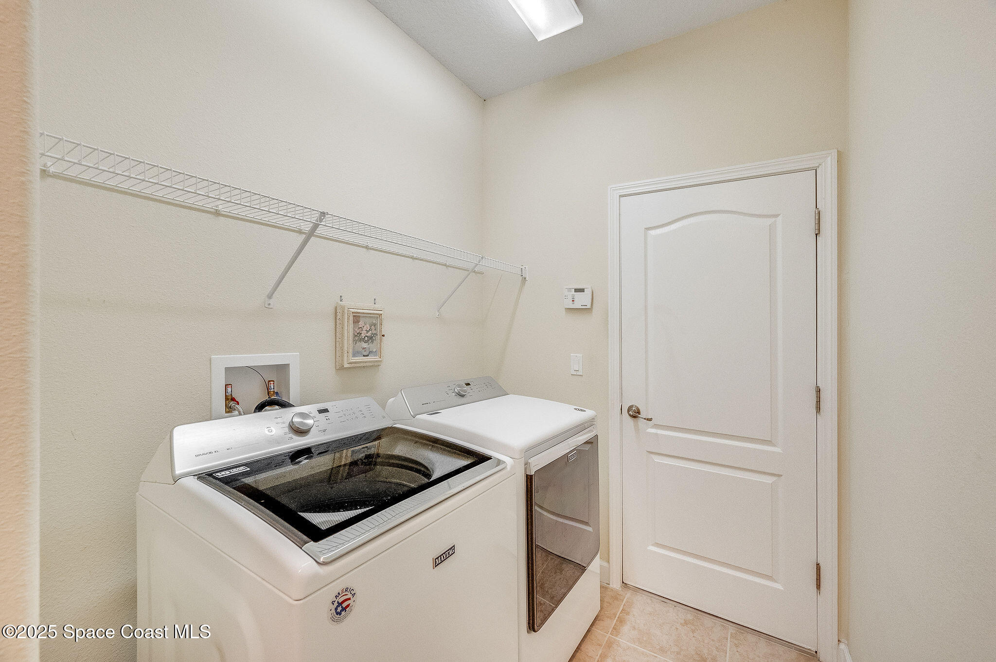6531 Ingalls Street Melbourne, FL 32940 - Photo 19 of 46 a utility room with dryer and washer
