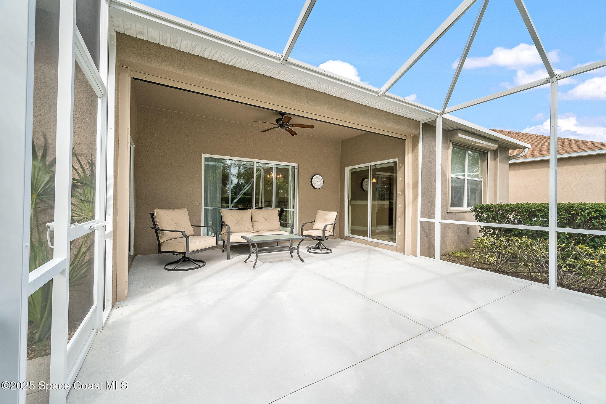 6531 Ingalls Street Melbourne, FL 32940 - Photo 21 of 46 a living room with patio furniture and a table