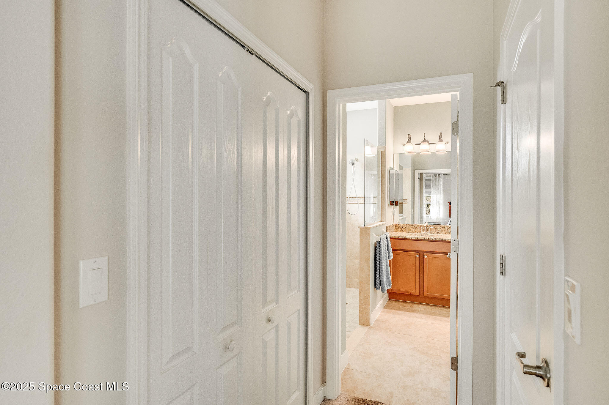 6531 Ingalls Street Melbourne, FL 32940 - Photo 42 of 46 a bathroom with a granite countertop sink a mirror and a shower