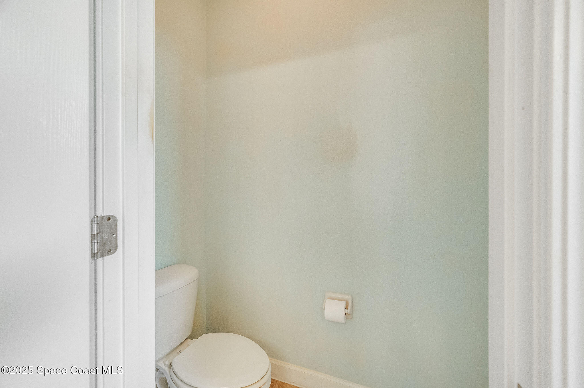 6531 Ingalls Street Melbourne, FL 32940 - Photo 45 of 46 a white toilet sitting next to a white sink