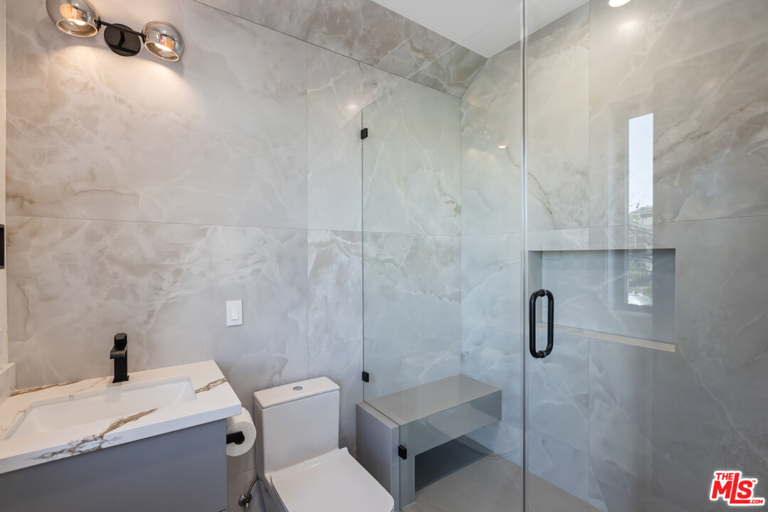3021 Stanford Avenue Marina del Rey, CA 90292 - Photo 34 of 38 a bathroom with a sink a toilet and shower