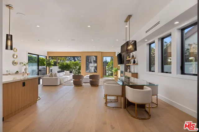 a living room with furniture or couch and a large window