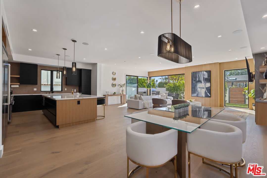 3021 Stanford Avenue Marina del Rey, CA 90292 - Photo 7 of 38 a large kitchen with a table and chairs