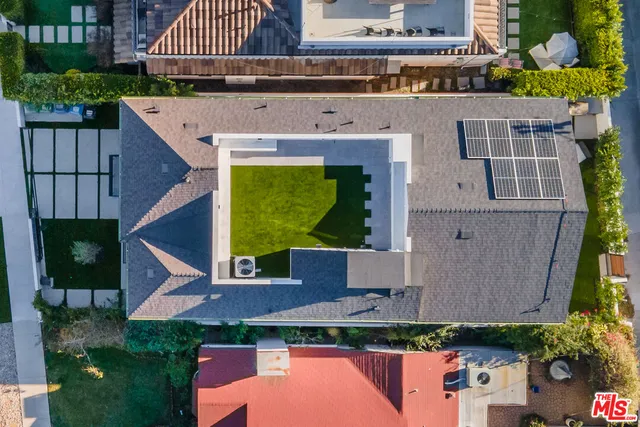 an aerial view of a house with a garden