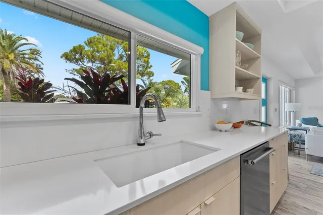 a bathroom with a bathtub and next to a window
