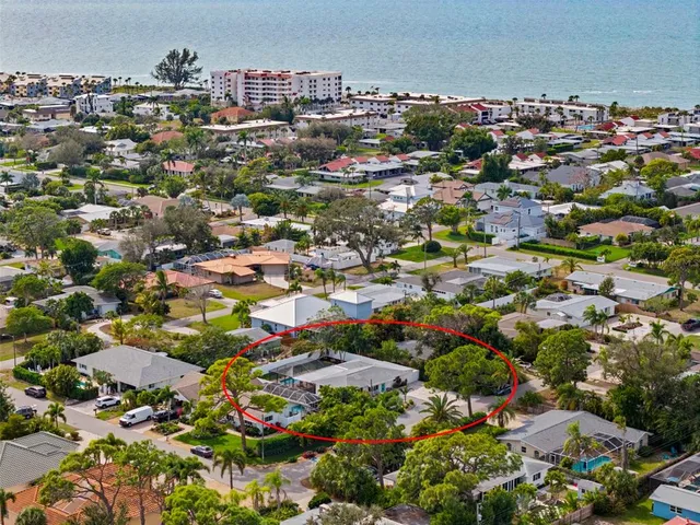 an aerial view of a multi story parking building with outdoor space