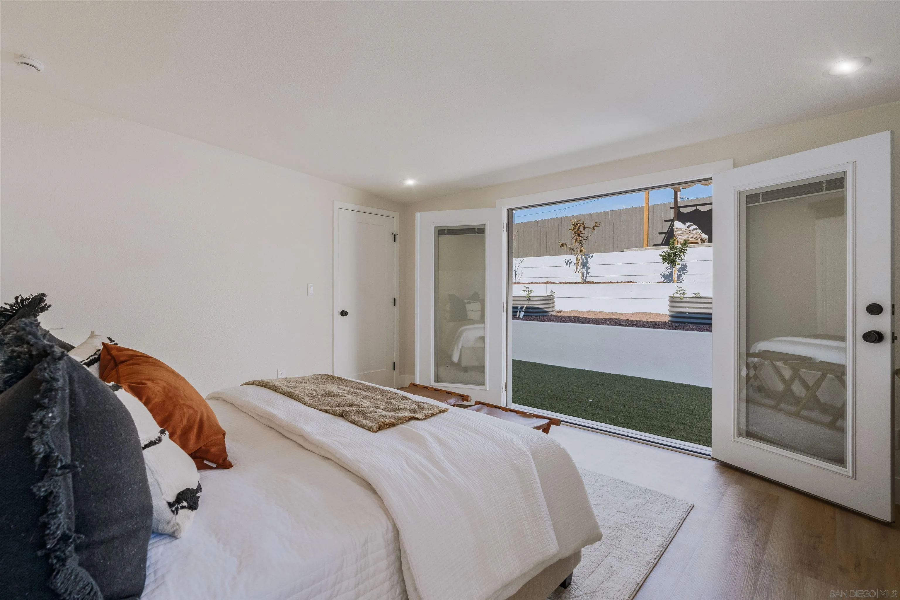 1426 Santa Rosa Street Oceanside, CA 92058 - Photo 38 of 73 a bedroom with a bed and a mirror