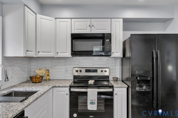 2330 Hubert Lane Chester, VA 23836 - Photo 14 of 43 Kitchen with black appliances, tasteful backsplash