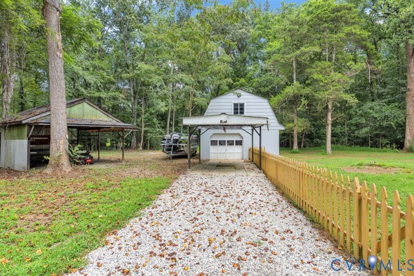 2330 Hubert Lane Chester, VA 23836 - Photo 39 of 43 View of yard with an outbuilding, gravel driveway,
