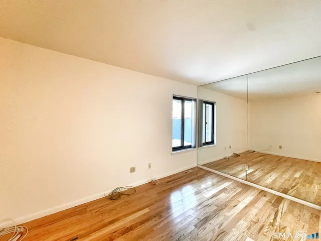 a view of an empty room and window