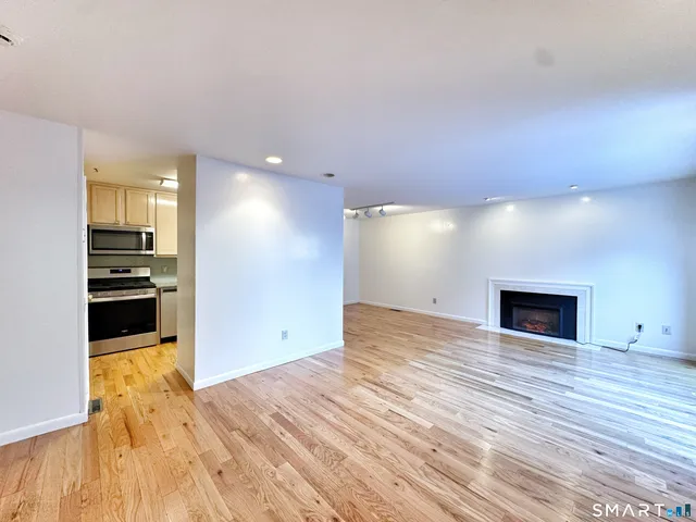 a view of a kitchen with a sink and a stove