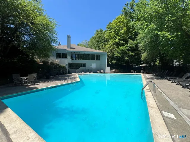 a view of a swimming pool with a patio