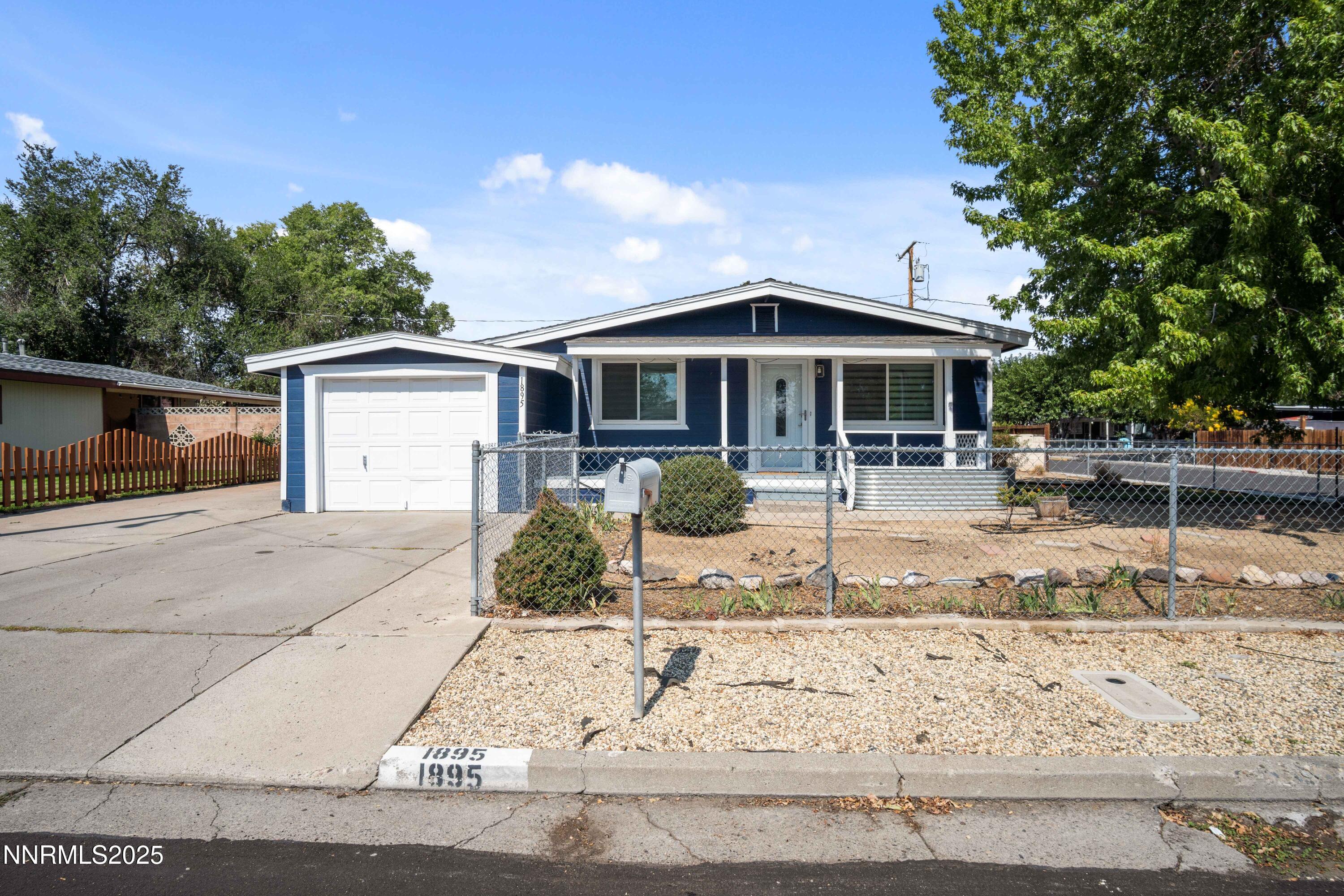 1895 Citron Street Reno, NV 89512 - Photo 1 of 37 a front view of a house with porch