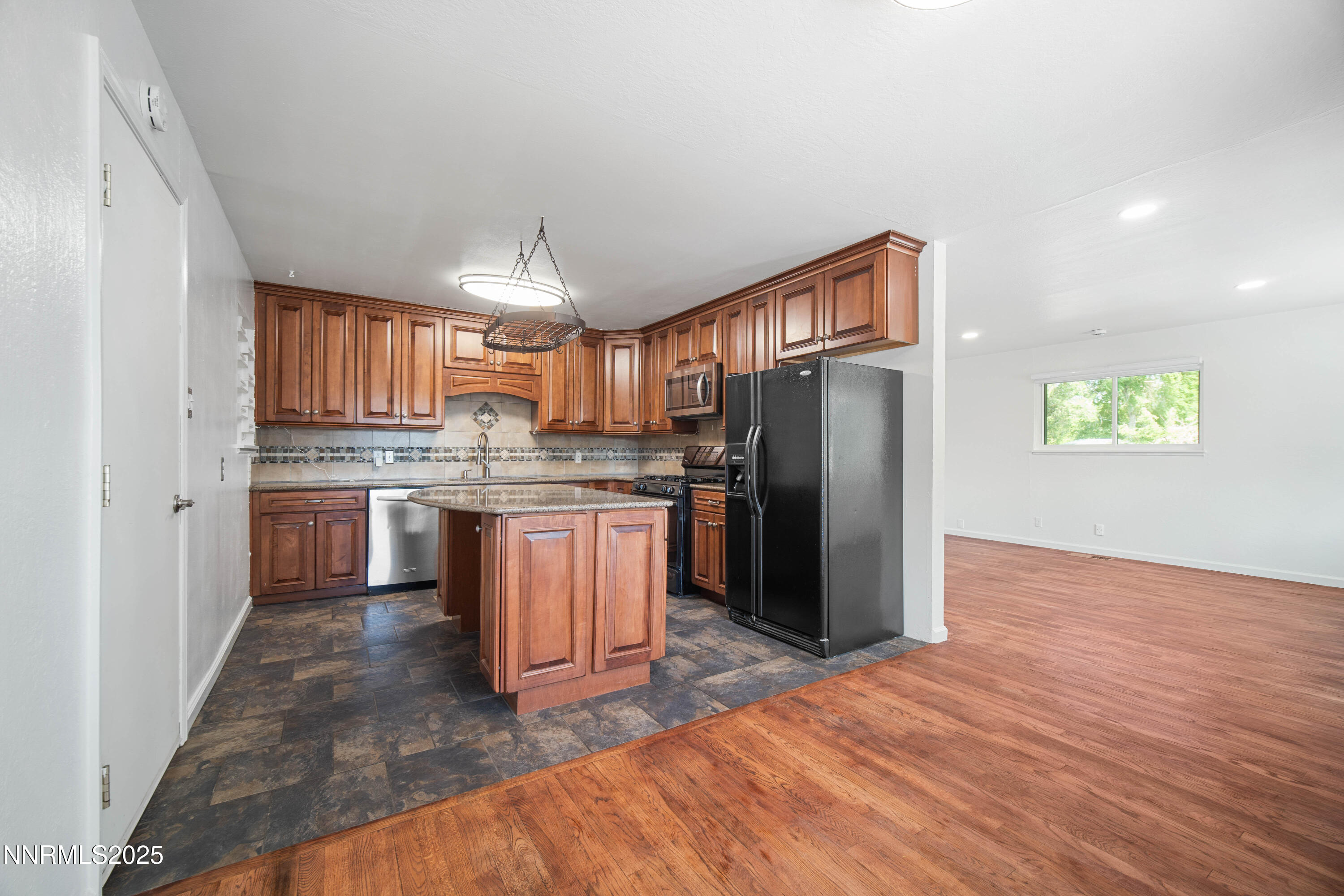 1895 Citron Street Reno, NV 89512 - Photo 11 of 37 a kitchen with stainless steel appliances granite countertop a refrigerator stove top oven and sink