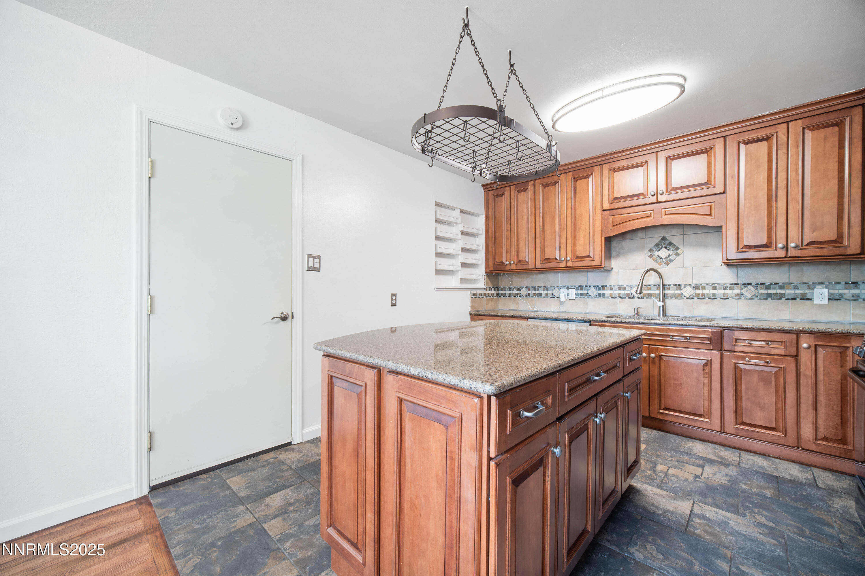1895 Citron Street Reno, NV 89512 - Photo 16 of 37 a kitchen with a counter space cabinets a sink and appliances