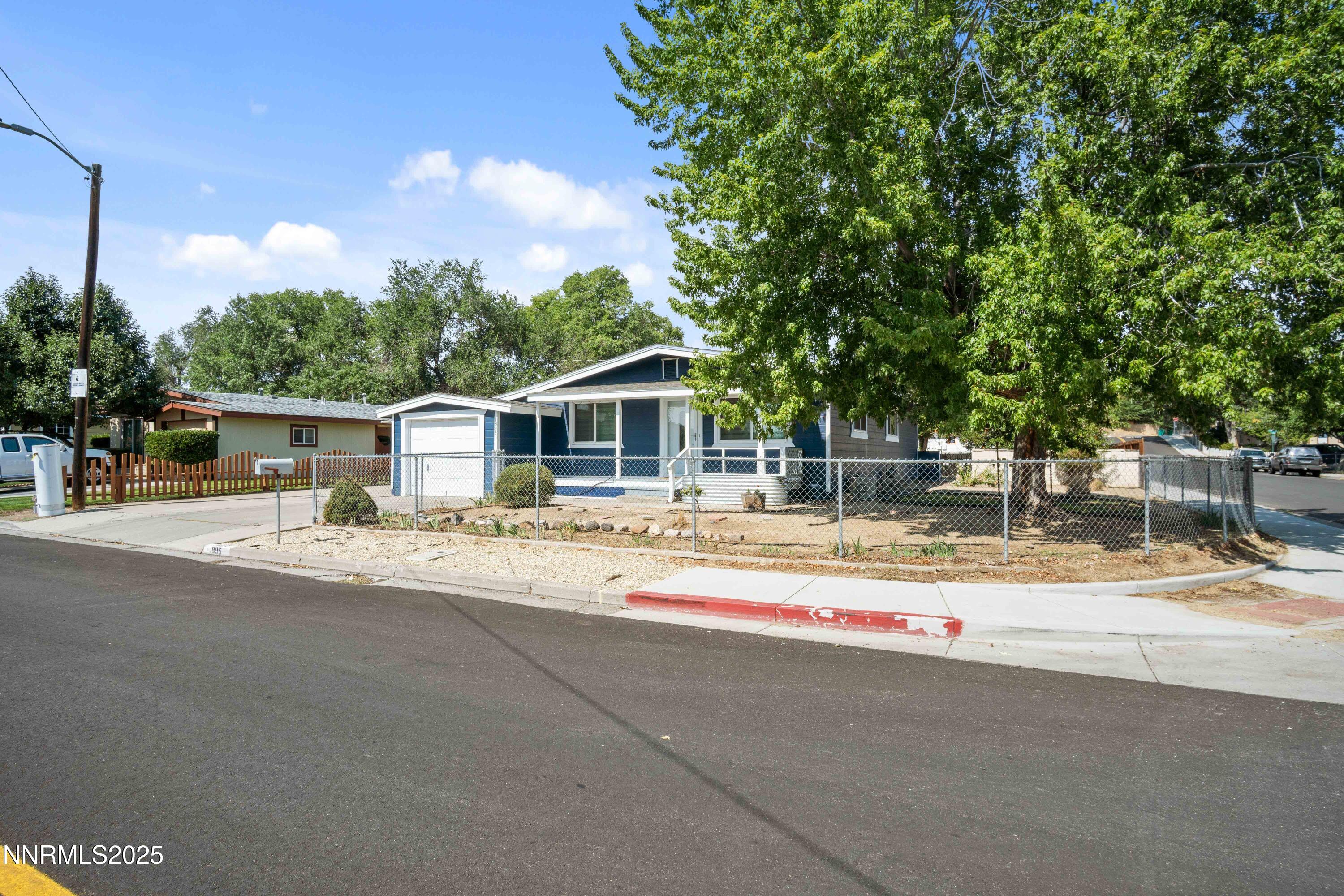 1895 Citron Street Reno, NV 89512 - Photo 2 of 37 a backyard of a house with table and chairs and potted plants