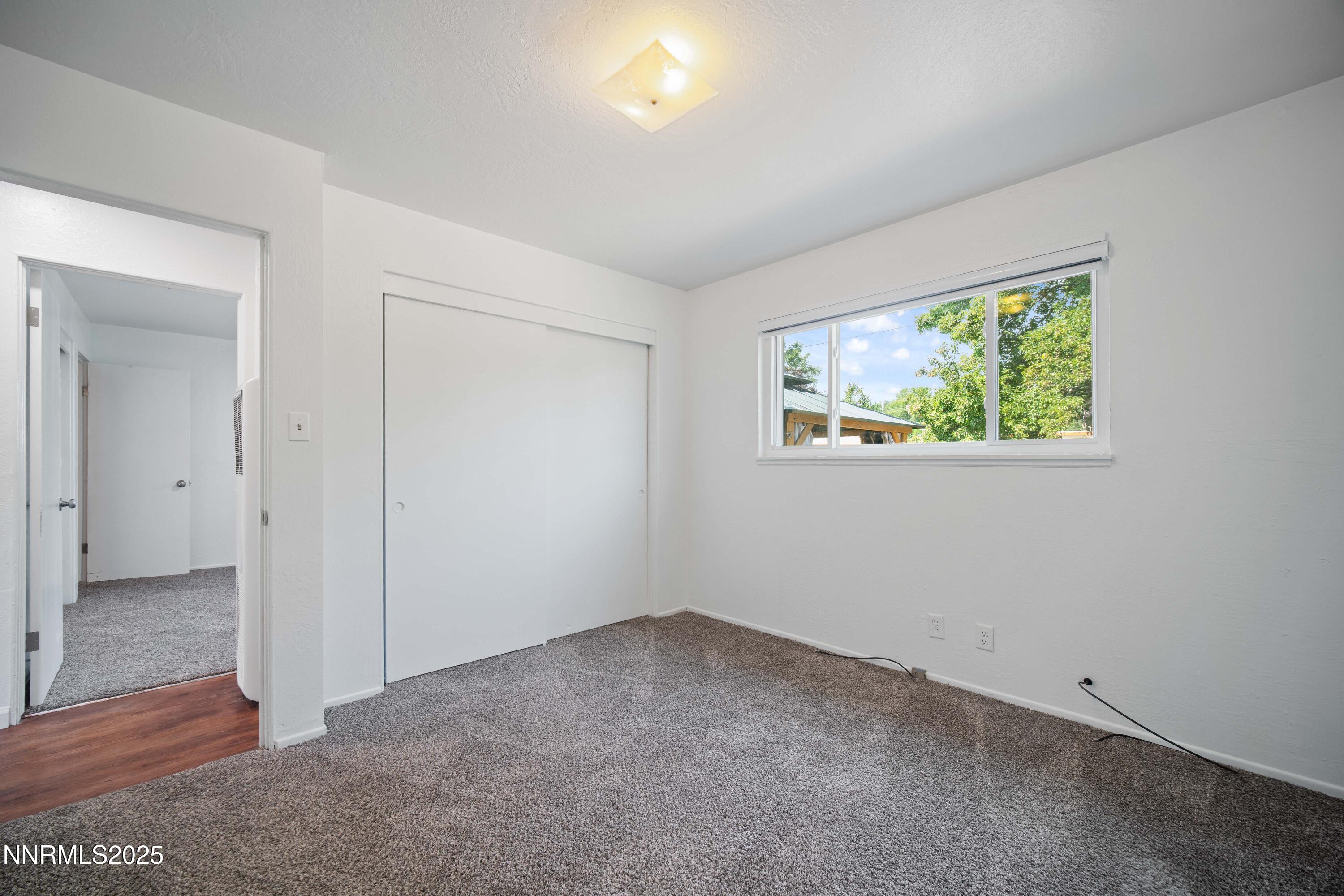 1895 Citron Street Reno, NV 89512 - Photo 22 of 37 an empty room with wooden floor and windows