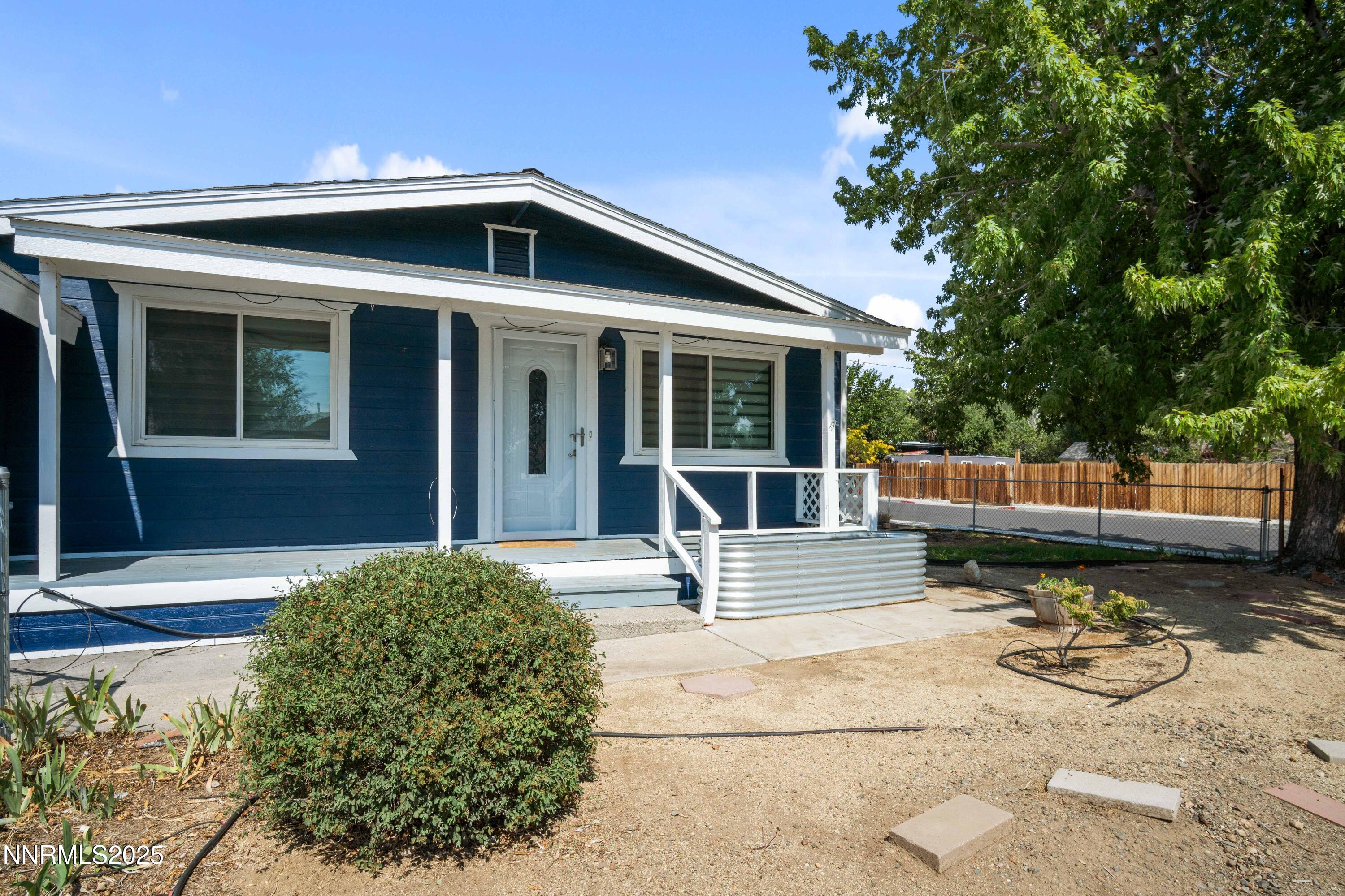 1895 Citron Street Reno, NV 89512 - Photo 4 of 37 a front view of a house with garden