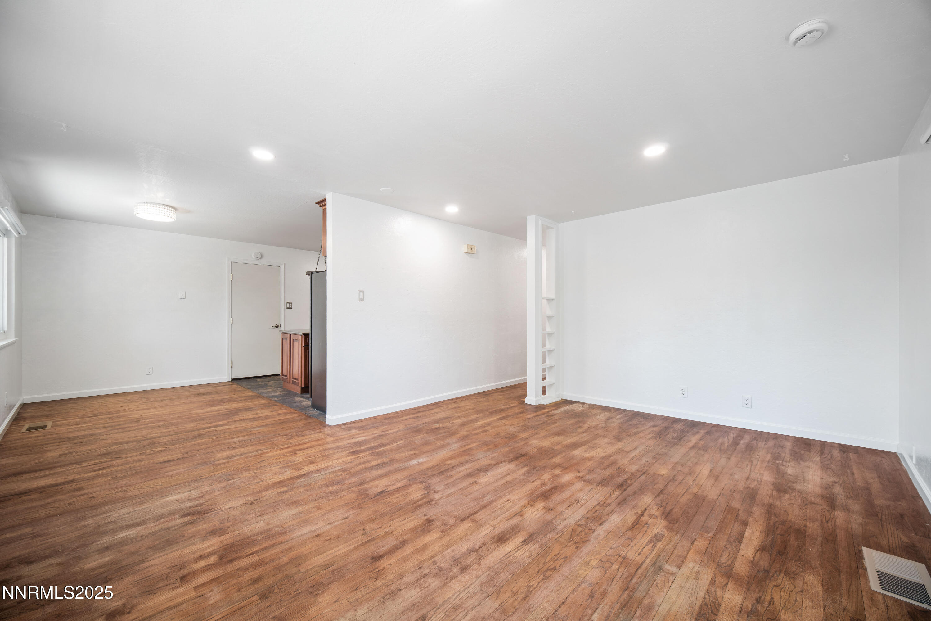 1895 Citron Street Reno, NV 89512 - Photo 9 of 37 a view of an empty room with wooden floor
