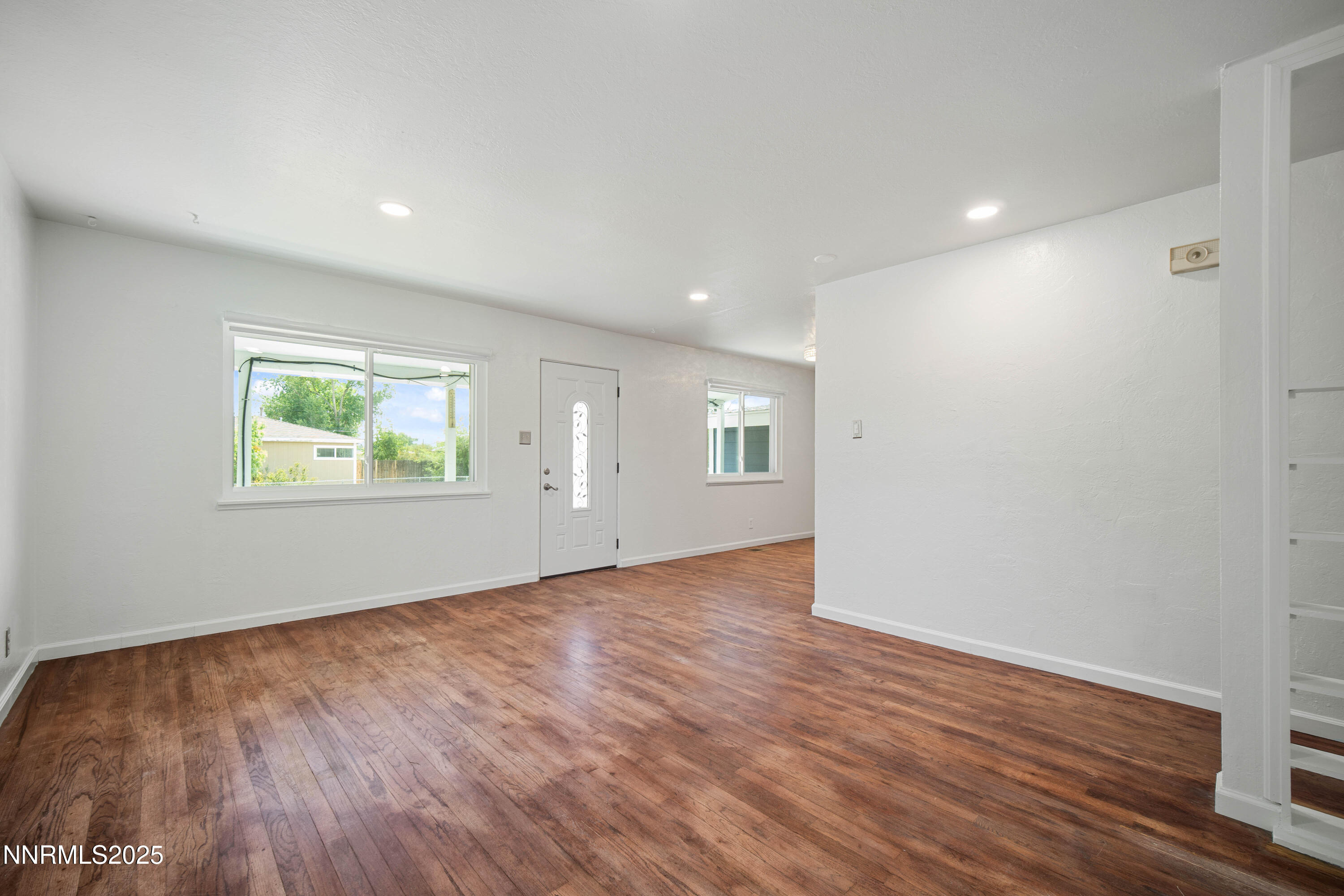 1895 Citron Street Reno, NV 89512 - Photo 10 of 37 a view of an empty room with wooden floor and a window