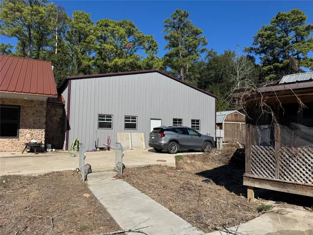 a kitchen with stainless steel appliances kitchen island granite countertop a refrigerator and a stove