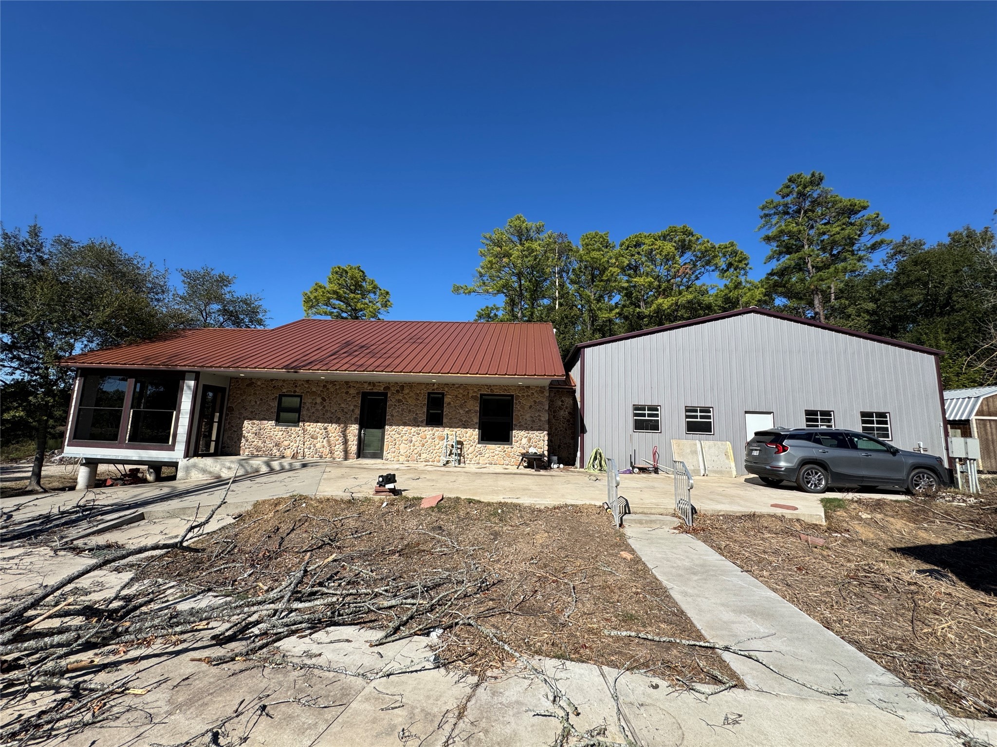 10505 Crosby Lynchburg Road Highlands, TX 77562 - Photo 15 of 24 a patio with a table and chairs under an umbrella
