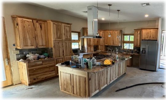 10505 Crosby Lynchburg Road Highlands, TX 77562 - Photo 18 of 24 a kitchen with stainless steel appliances kitchen island granite countertop a refrigerator and a stove