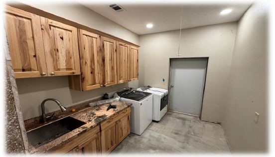 10505 Crosby Lynchburg Road Highlands, TX 77562 - Photo 20 of 24 a kitchen with stainless steel appliances a stove a sink and a refrigerator