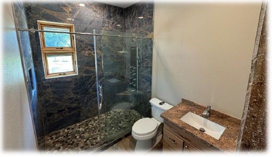 10505 Crosby Lynchburg Road Highlands, TX 77562 - Photo 21 of 24 a bathroom with a sink toilet and shower