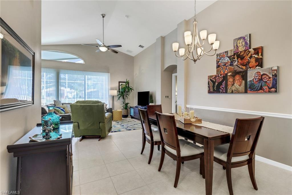 9001 Springview Loop Estero, FL 33928 - Photo 13 of 50 a view of a dining room with furniture and chandelier