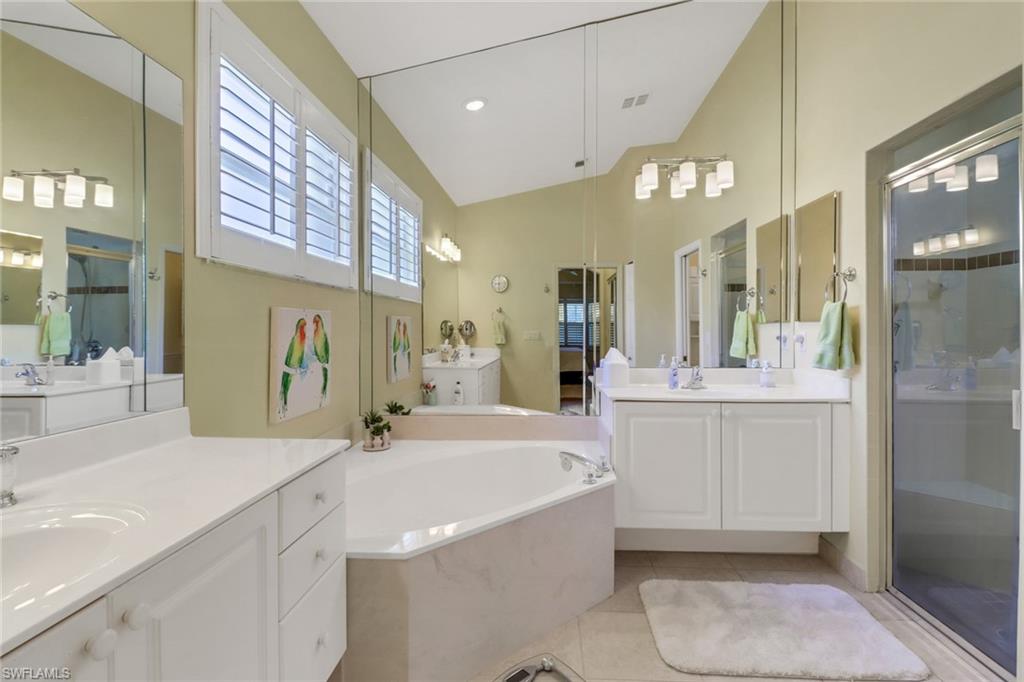 9001 Springview Loop Estero, FL 33928 - Photo 17 of 50 a bathroom with a sink a toilet and shower