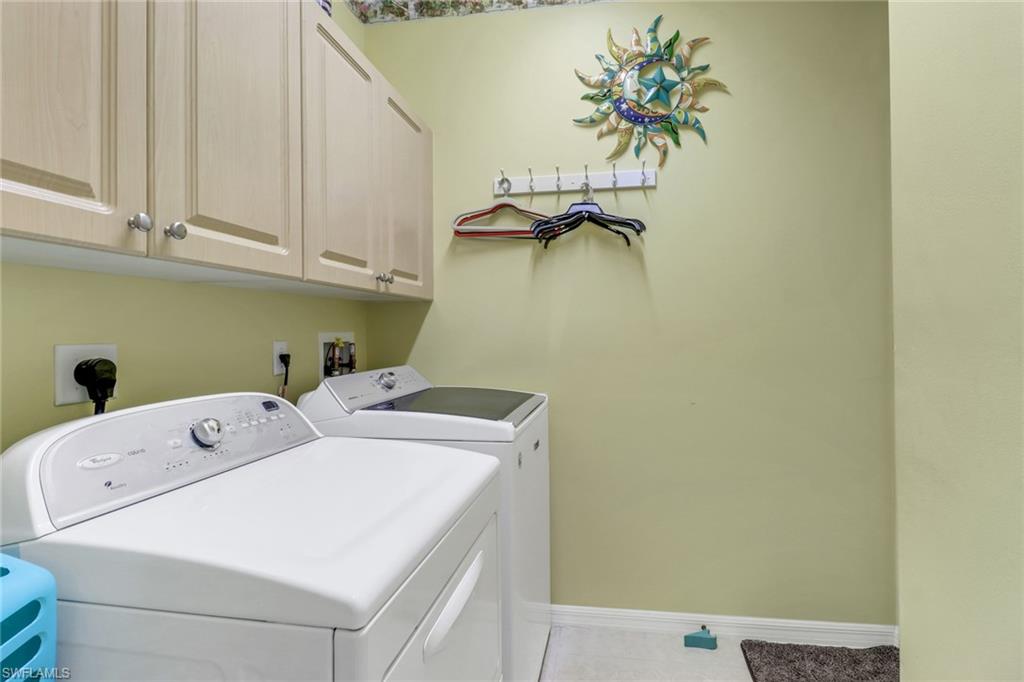 9001 Springview Loop Estero, FL 33928 - Photo 22 of 50 a utility room with dryer and washer