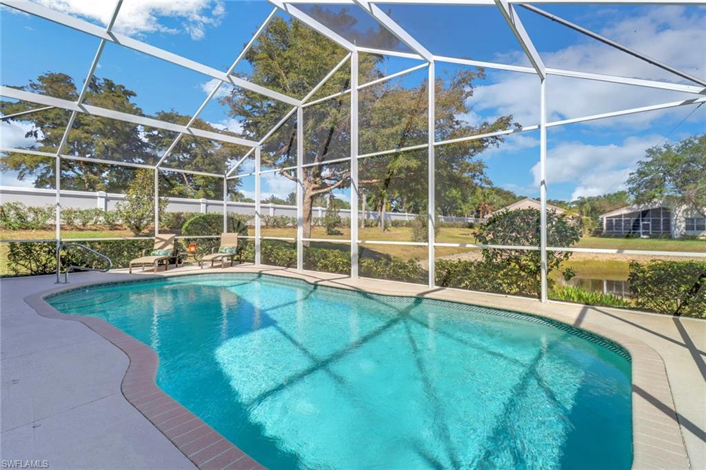 9001 Springview Loop Estero, FL 33928 - Photo 25 of 50 a view of a swimming pool with a yard