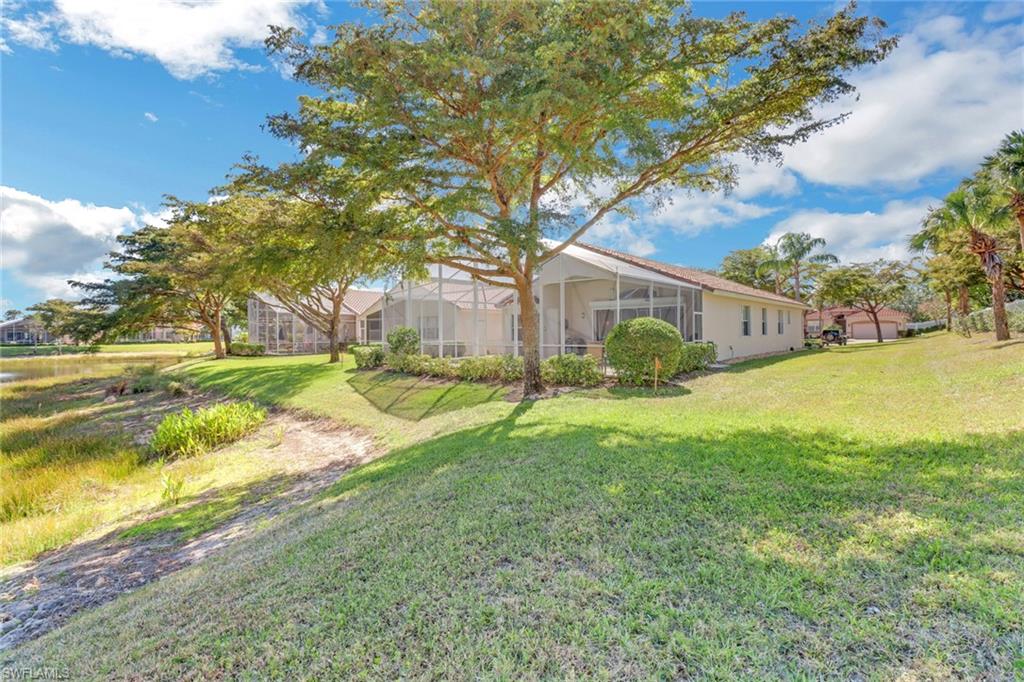 9001 Springview Loop Estero, FL 33928 - Photo 28 of 50 a view of a house with a yard