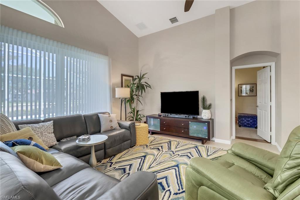 9001 Springview Loop Estero, FL 33928 - Photo 5 of 50 a living room with furniture and a flat screen tv